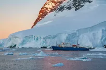 Tourist icebreaker in the Lamaire Channel on the Antarctic Peninsula in Antarctica.